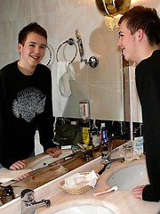 Smiling nude teen boy in bathtub