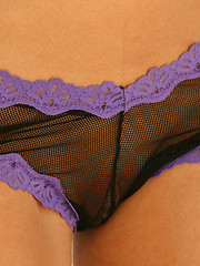 Carolyn Michelle teases in her black and purple see thru lingerie