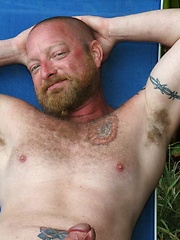 Ginger muscle pig Dawlton Hawg relaxes by the pool waiting for his next bareback conquest