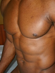 Bald black guy shows his uncut dick