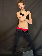 Cute boy with a tad bit of makeup and with something yummy between his hips